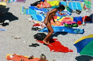 Ula FKK Sexy brunette on a nude beach topless, bottomless and with blue thong