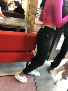 Teen in a top and black jeans