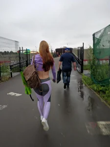 Amazingly fit and tall candid redhead girl wearing purple top and leggigns