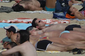 Topless girls on a beach in Barcelona