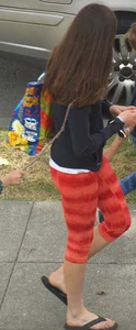Beautiful brunette teen in orange patterned leggings