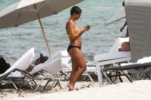 Frankie Bridge nip slips in a bikini on the beach