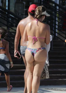 Latina milfs on a beach in Florida in thong bikinis with big booties