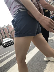 Young Girl in Shorts And Sandals Crossing the Street Gallery