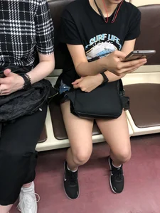 Candid Girl in Shorts Sitting in Subway Train Photos