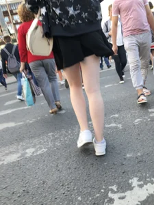 Candid girl wearing a short skirt crossing the street, awesome pale legs