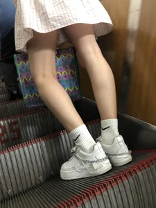 Cute Girl in a Dress with Thin Hot Legs Standing on the Subway Escalator Closeup Creepshots Gallery