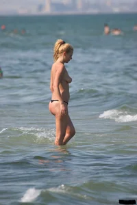 A bunch of sexy beach voyeur babes in bikinis, thongs and topless