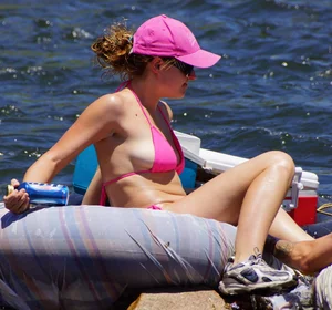 Sexy party girls in bikinis on a lake