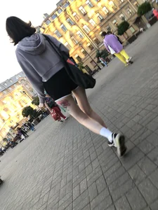 A Tall And Slim Candid Girl in Spandex Shorts in a Hoodie Top, With Tattoos on Her Long Legs Subway Creepshots