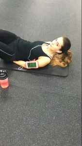 Sexy gym girl with a nice body in leggings as she works out
