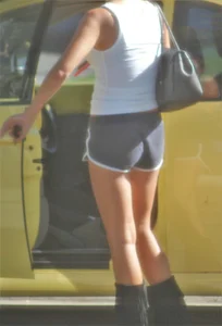 Skinny babe going to her car in little cotton shorts