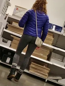 Blonde lady shopping in tight dark grey leggings