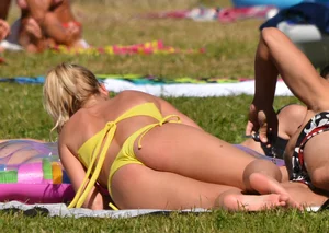 Blonde looking sexy in a yellow bikin