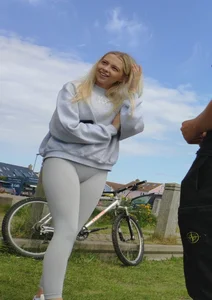 Pretty blonde in white leggings at the beach