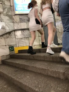 Group of Teens in Short Dresses in a Subway Train and on an Escalator Gallery