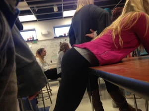 Blonde Girl in Yoga Pants Bending Over Desk