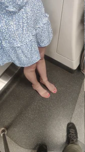 Cute Feet of a Girl in a Dress in a Subway Train - Pink Pedicure And Tender Legs