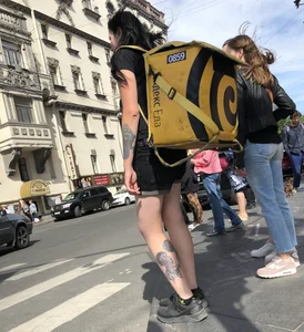 Amazing cute candid food delivery girl with lots of tattoos crossing the street