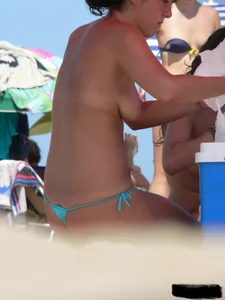 2 topless thonged sexy friends on the beach with great bodies