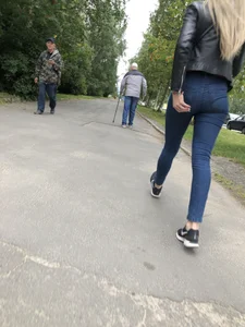 Young Blonde Girl in Tight Blue Jeans Scratching Her Booty While Passing By on the Suburban Street Creepshots Gallery