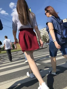 Girl in a Skirt with Sexy Skinny Legs on the Crosswalk Candid Photos