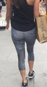 Sexy girl walking in grey patterned leggings with friend in tight jeans