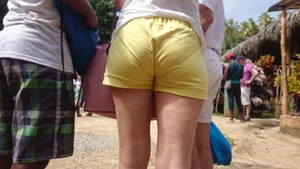 Milf in yellow shorts with vpl and a wedgie