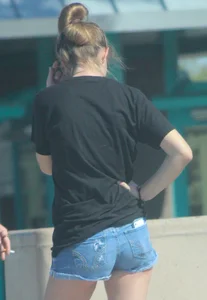 Candid skinny college girl in denim shorts showing some cheeks