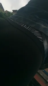 Girl with a nice ass in leggings walking down the street