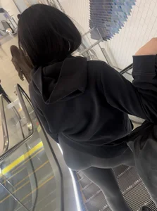 Tight curvy latina at airport pulls up pants