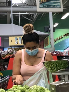 Thick Latina babe with a nice ass in tight patterned shorts