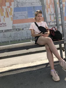 Bus Stop Girl Sitting with Crossed Legs Street Candid Photos