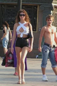 Gorgeous candid chick wearing a top, mini-shorts and sandals street creepshot; long and skinny legs