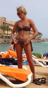 Sexy blonde babe in a bikini at the pool