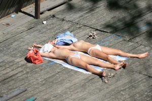 Two teens stripping and going topless to tan