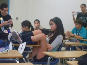 College Girl with Her Legs on Table Candid