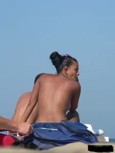 Hot ass topless beach girl with great tits lets her little brother oil up her ass in thong bikini