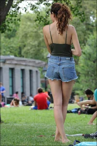 Gymnast or yoga girl in the park in shorts and no bra and even showing some pussy