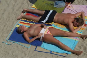Girls on a nude beach in Sitges, Spain