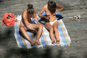 Two teens stripping and going topless to tan