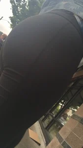 Girl with a nice ass in leggings walking down the street