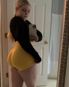 Cute blonde chubby tee's selfie in yellow spandex shorts