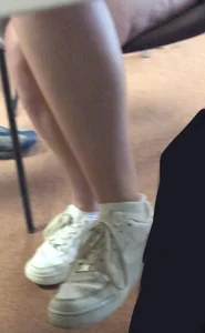 Candid Crossed Legs Closeups And Feet in Sneakers