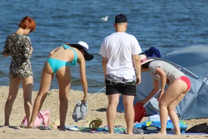 Couple of hot babes hanging out at the beach in bikinis