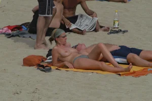 Topless girls on a beach in Barcelona