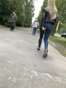 Young Blonde Girl in Tight Blue Jeans Scratching Her Booty While Passing By on the Suburban Street Creepshots Gallery