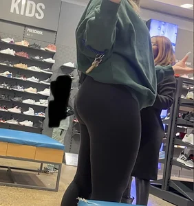 Blonde Finish line store worker in black leggings