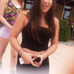 Teens fooling around on the street, pulling down pants