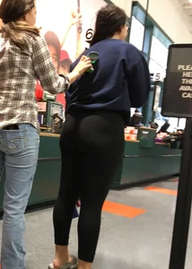 Brunette with glasses and big booty in leggings at Dicks